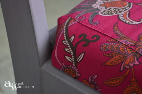 Use an old piece of clothing to recover a small piece of furniture. There are some cute clothes out there! For this and more great ideas, visit AmbientWares.com