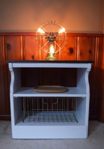 This old beat up microwave cart got a simple farmhouse styled makeover. For this and more fun projects, visit AmbientWares.com #farmhousestyled #oldmicrowavecart #oldtvcart