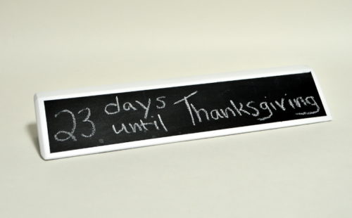 23 days until Thanksgiving written on chalkboard name plate