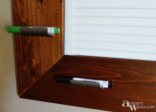 Close up of the dry erase markers in their drawer handle holders