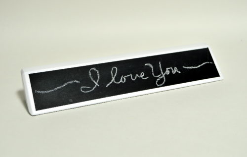 I love you written on chalkboard name plate.JPG