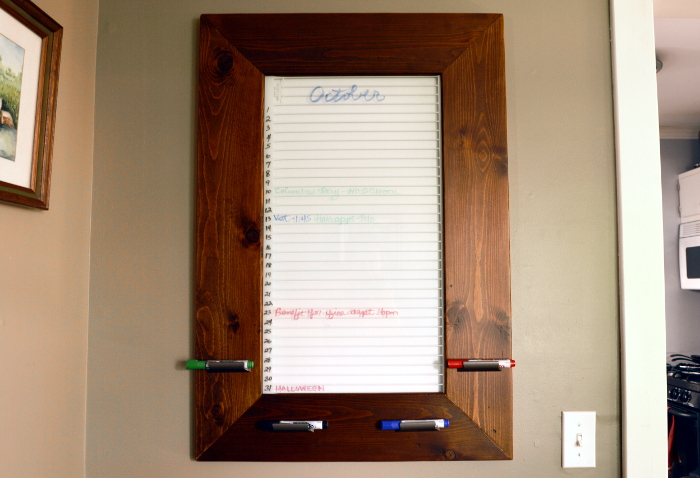 Create this awesome DIY framed dry erase board from an old refrigerator shelf! ~ ambientwares.com