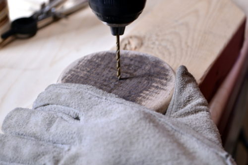 Drilling a hole in the center of the handmade lid