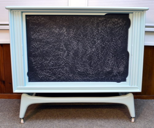 I love upcycled furniture ideas like this one! She transformed an old tube TV shell into the cutest organization station with a chalkboard as well as a shelf for added storage! For this and more unique ideas, visit AmbientWares.com