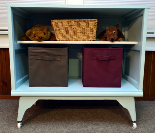 I love upcycled furniture ideas like this one! She transformed an old tube TV shell into the cutest organization station with a chalkboard as well as a shelf for added storage! For this and more unique ideas, visit AmbientWares.com