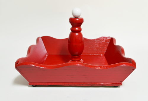 Wooden nutcracker dish painted in apple red