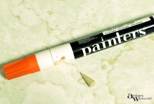 Using a painters marker for the craft stick snowman nose