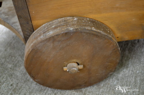 Wooden wagon wheel in original condition before removing