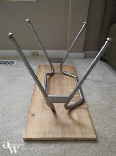 Don't throw away that disgusting plastic chair just yet. Repurpose the metal legs and DIY your own industrial style side table! For this and more unique ideas, visit AmbientWares.com