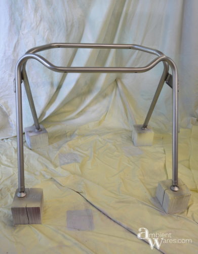 Don't throw away that disgusting plastic chair just yet. Repurpose the metal legs and DIY your own industrial style side table! For this and more unique ideas, visit AmbientWares.com